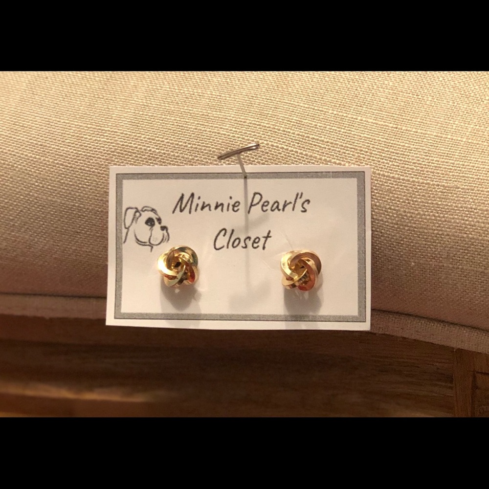 Gold circular earrings.